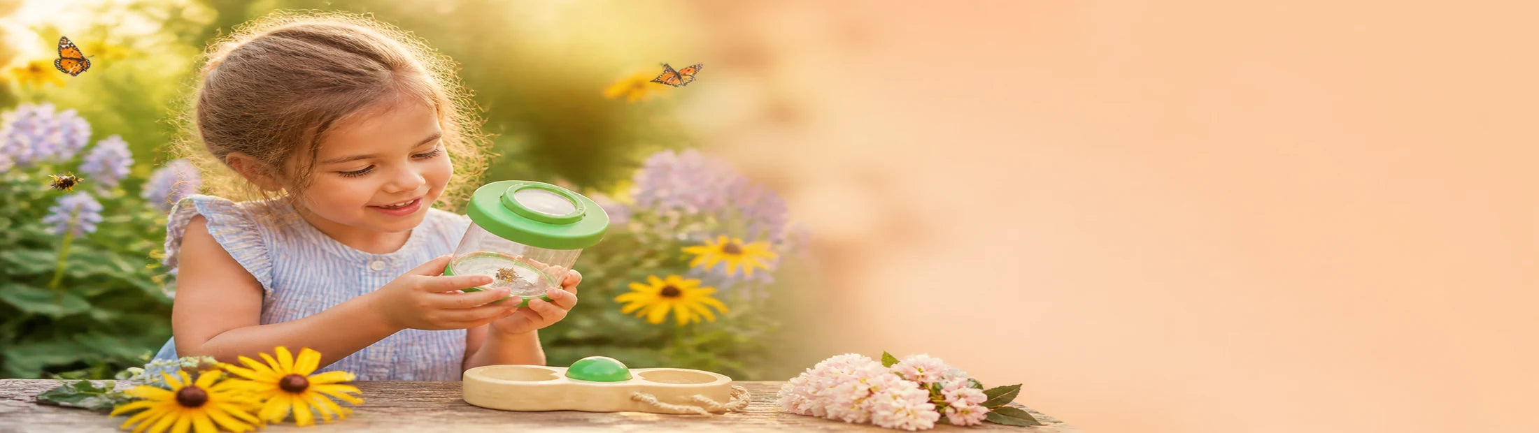 Child exploring outdoors with a learning toy